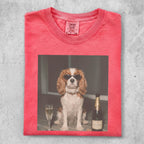 Dog in sunglasses sits next to champagne bottle and glass.