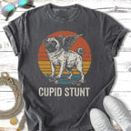 Pug with wings riding a skateboard, vintage sunset graphic, "Cupid Stunt" text.