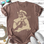Pug wearing a cowboy hat plays a guitar on a vintage-style t-shirt.