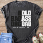 Dark grey t-shirt with "BOLD BADASS DOG DAD that's just who I am!" text.