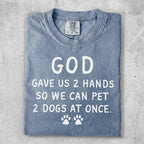 Comfort Colors t-shirt with "GOD GAVE US 2 HANDS SO WE CAN PET 2 DOGS AT ONCE." text.