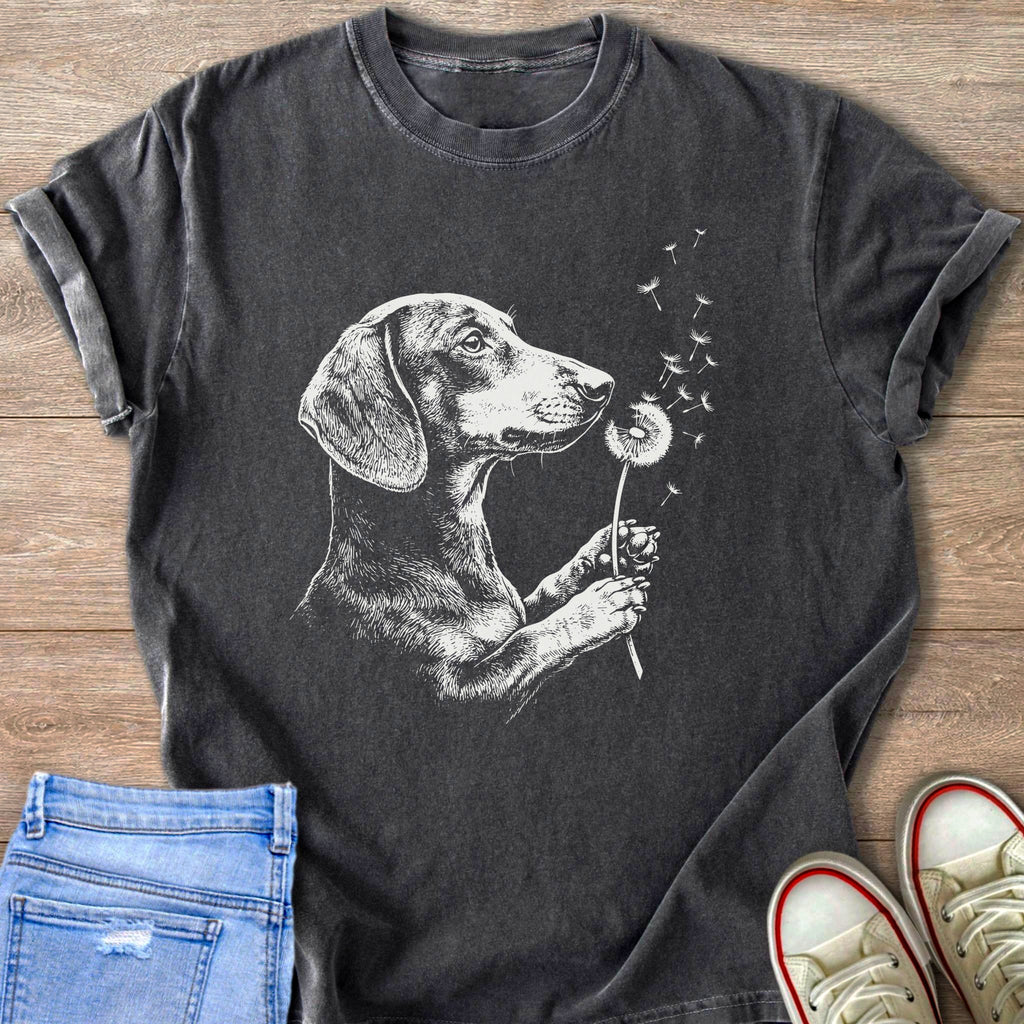Dark grey t-shirt with white sketch of a dachshund holding a dandelion