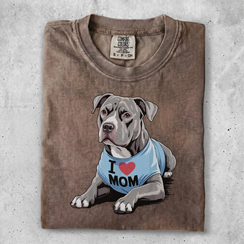 Pit bull wearing a blue t-shirt that says "I Love Mom".