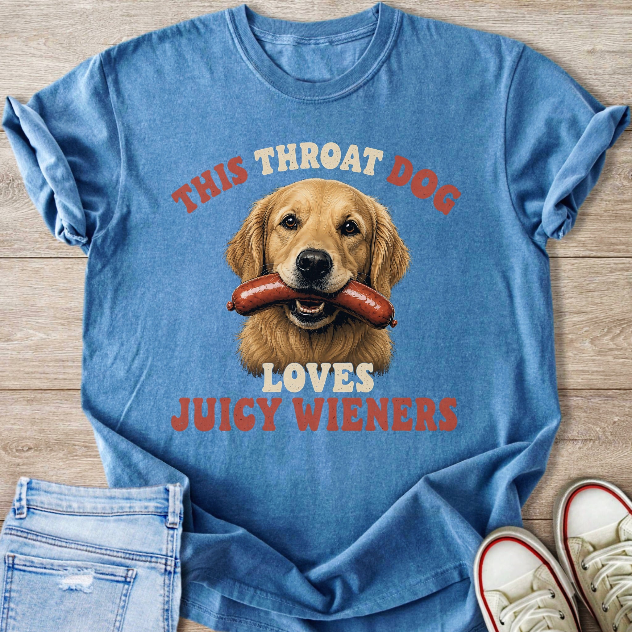 Golden retriever with sausage in mouth on blue t-shirt, text: "This Throat Dog Loves Juicy Wieners".