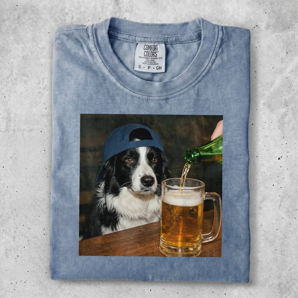 Dog wearing a baseball cap, receiving a beer pour into a mug.