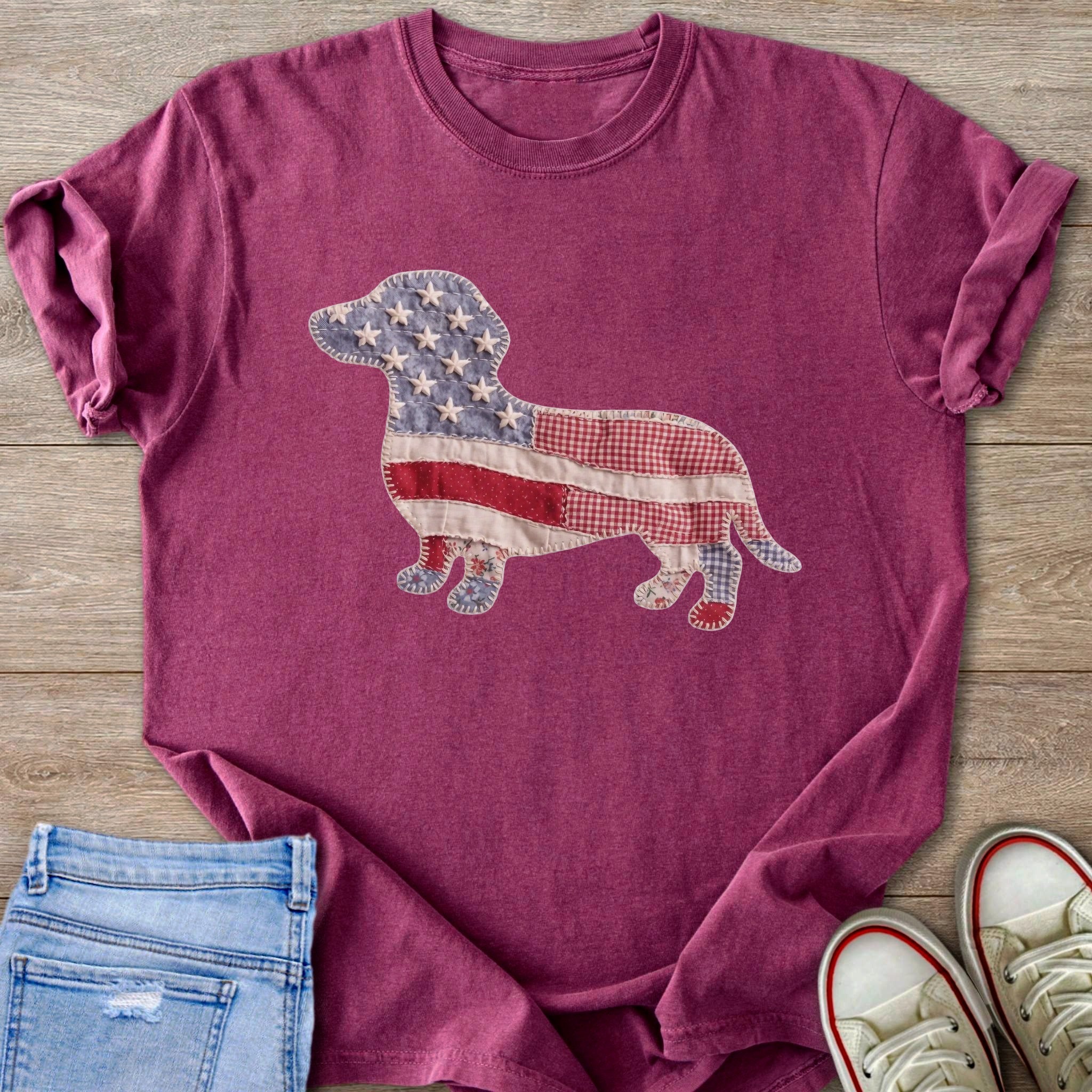 Maroon t-shirt with a dachshund silhouette made of American flag patchwork.