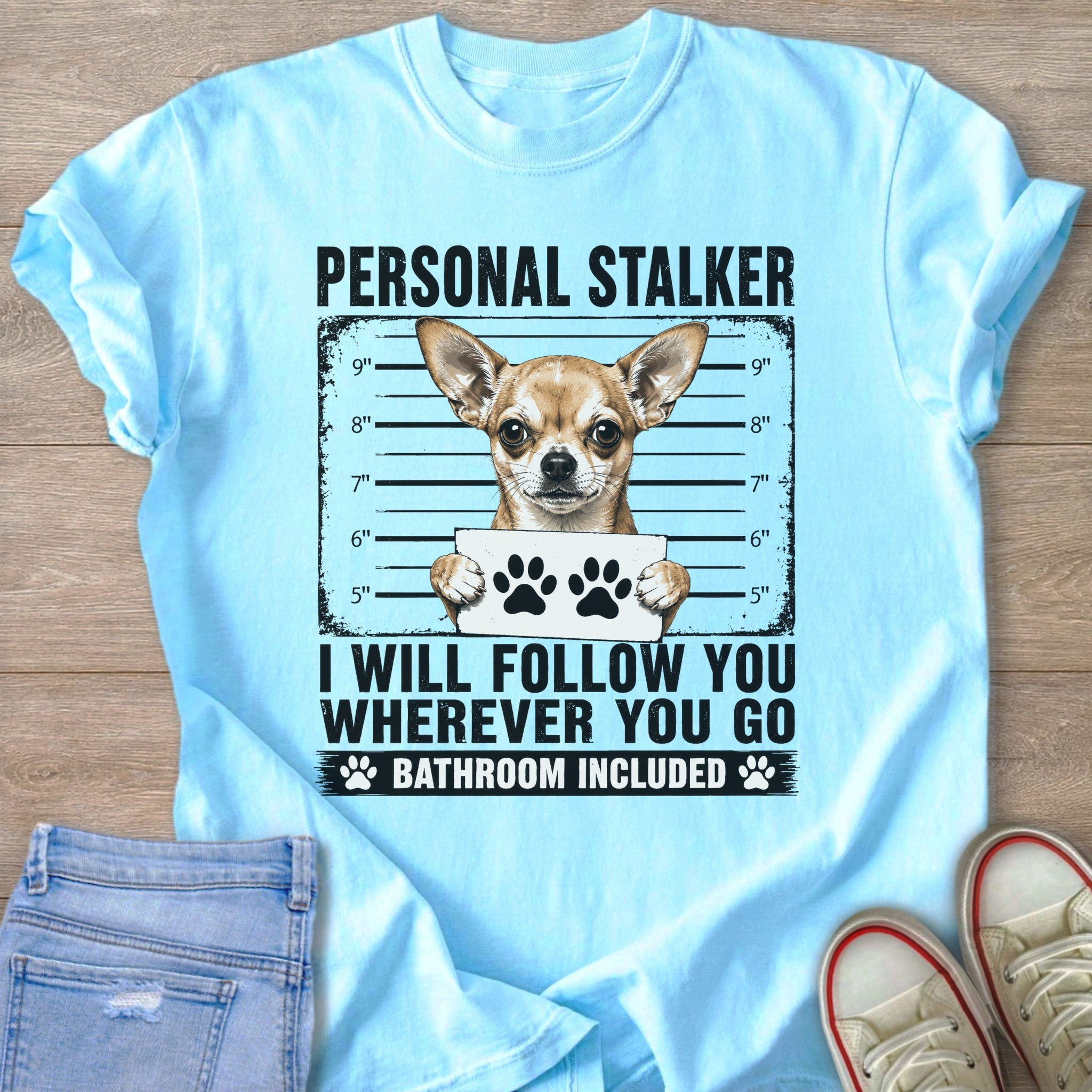 Light blue t-shirt with "Personal Stalker" and a chihuahua holding paw prints.
