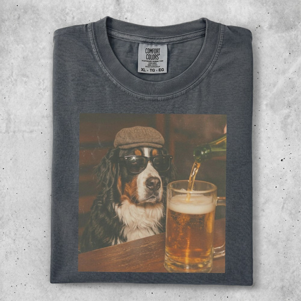 Bernese Mountain Dog wearing sunglasses and hat pours beer into a mug.