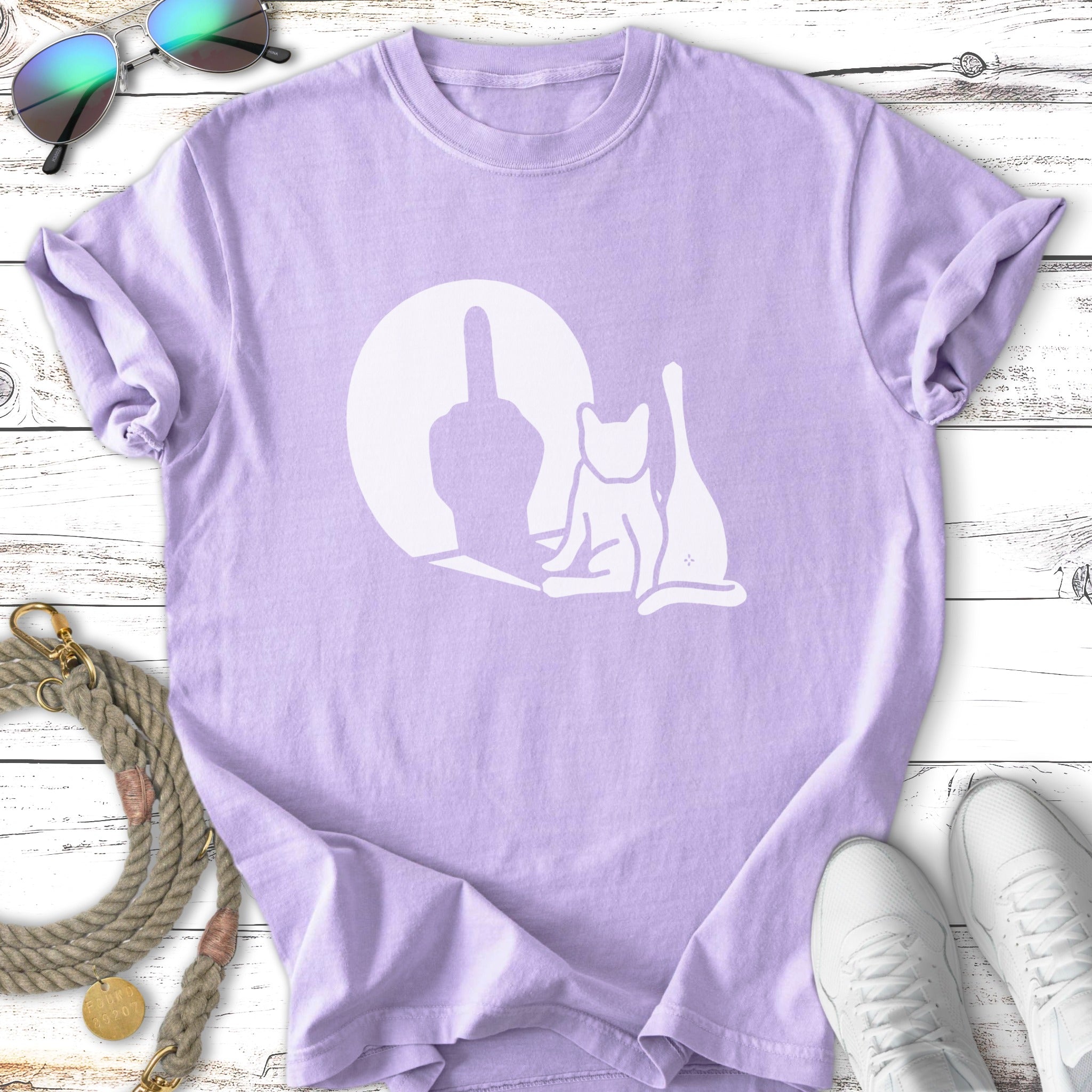 Light purple t-shirt with white silhouette of a cat and a middle finger.