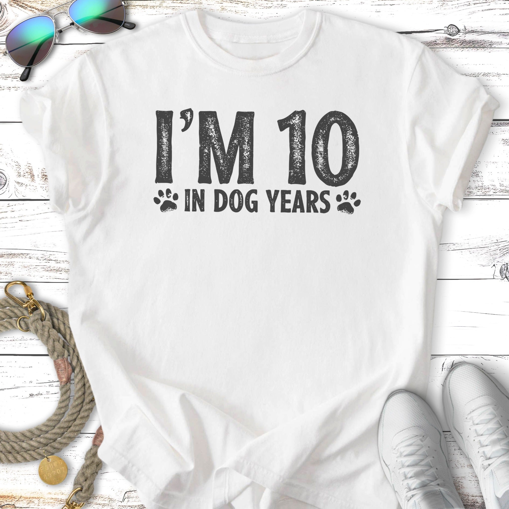 White t-shirt with "I'M 10 IN DOG YEARS" text.