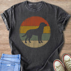 Dark t-shirt with a dark dog silhouette within a distressed retro sunset circle.
