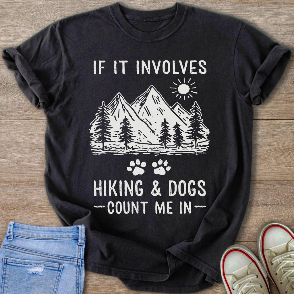 Black t-shirt with mountains, trees, sun, and text "If it involves hiking & dogs - count me in".
