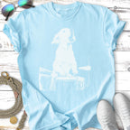 Light blue t-shirt with white sketch of a dog playing drums.