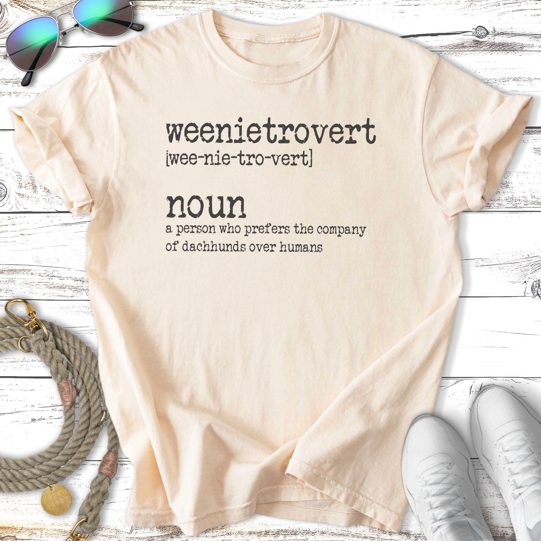 Cream t-shirt with "weenietrovert" definition about preferring dachshunds over humans.