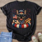 French bulldog wearing "Merica" hat, star sunglasses, and bandana, holding flag and hot dog.