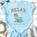 Light blue t-shirt with "RELAX" and "NOTHING IS UNDER CONTROL" text.