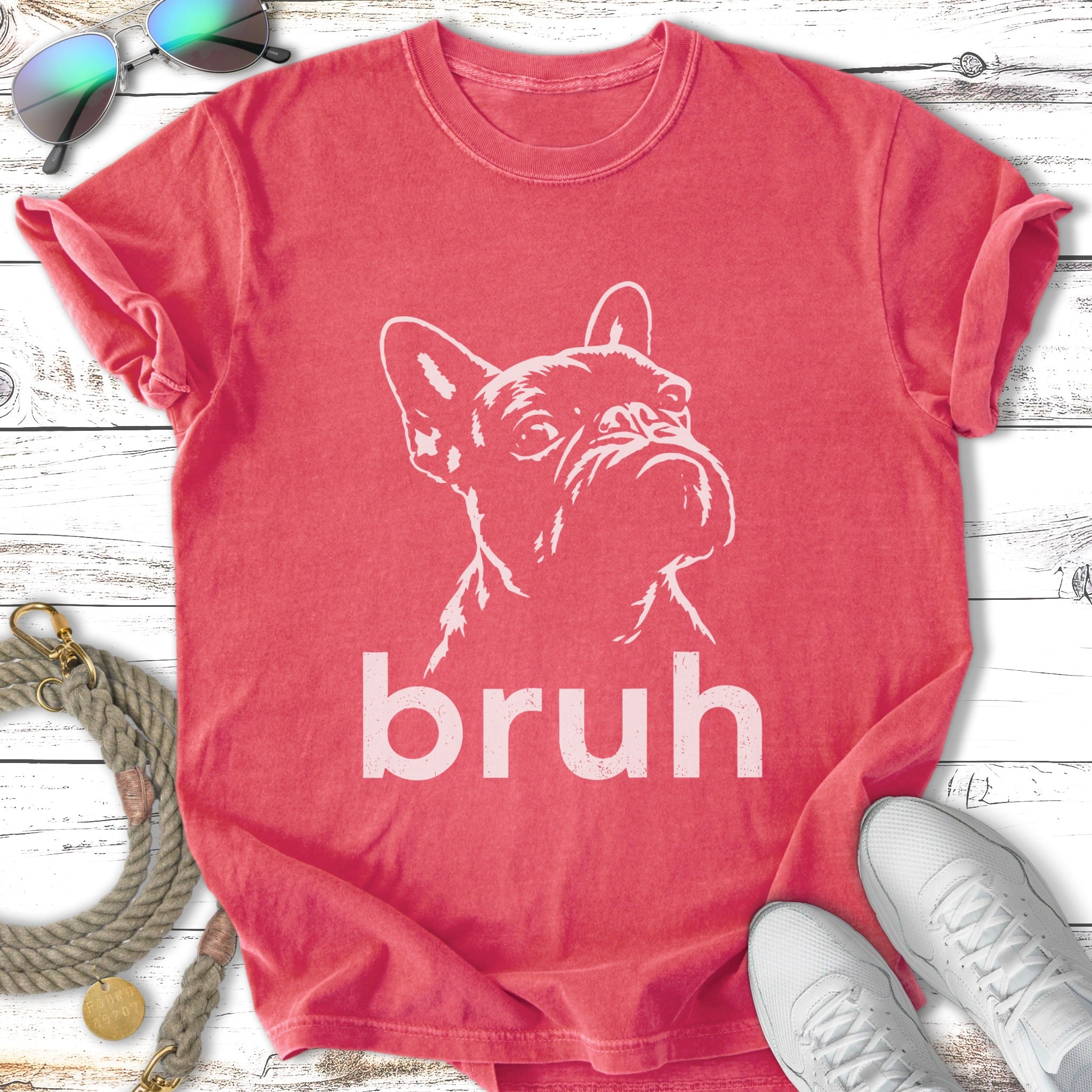 French bulldog graphic on a distressed coral t-shirt.