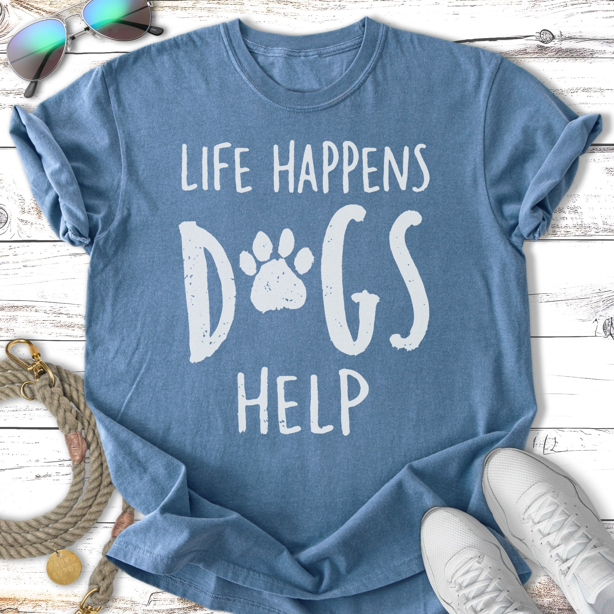Blue t-shirt with "Life Happens Dogs Help" in white distressed text.
