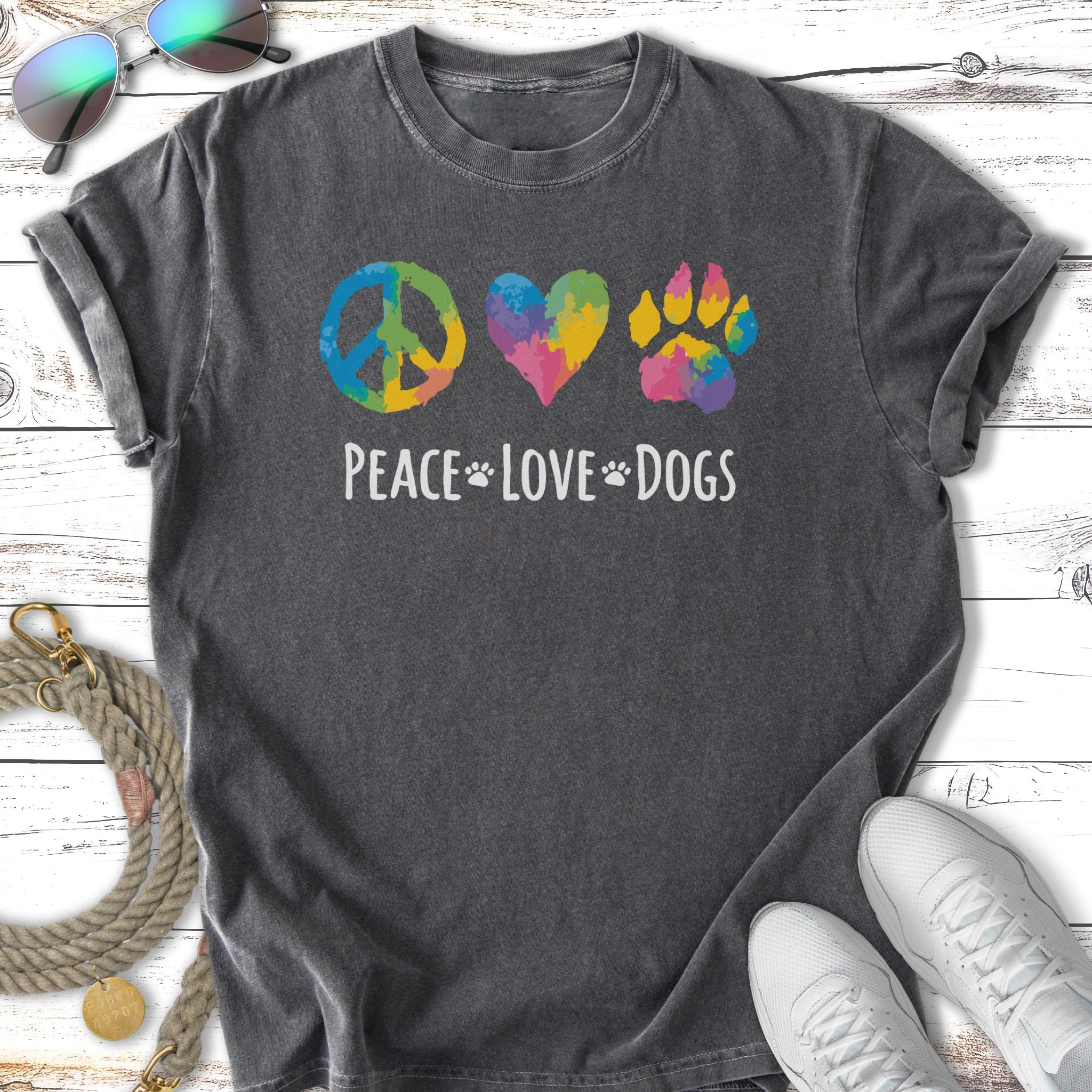 Dark t-shirt with "Peace Love Dogs" text and colorful peace sign, heart, and paw print.