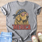 Dog wearing American flag bandana and sunglasses, text "'MERICA" on shirt.