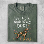 Green t-shirt with floral dog illustration and "Just a girl who loves dogs" text.