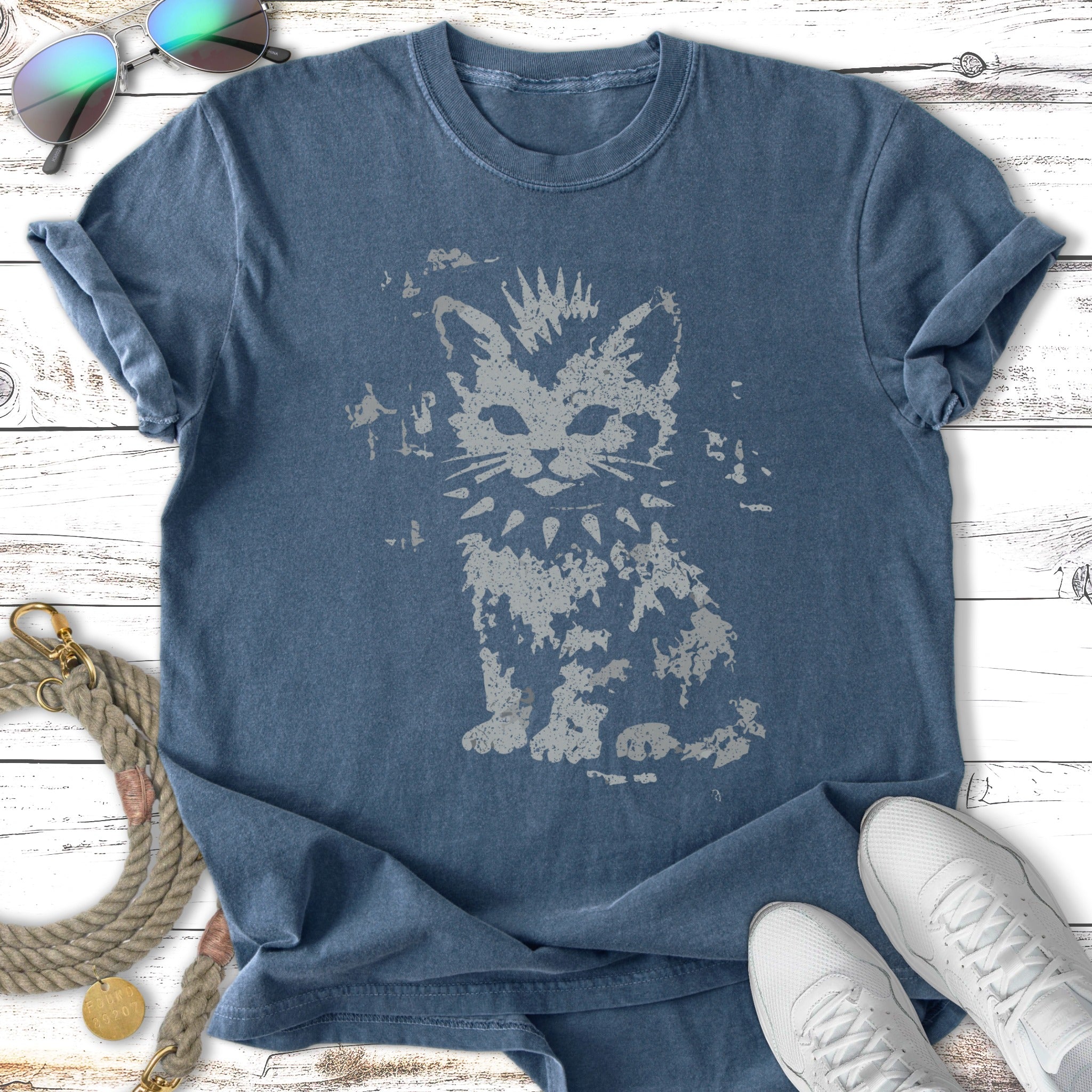 Dark blue t-shirt with distressed graphic of a crowned cat wearing a spiked collar.