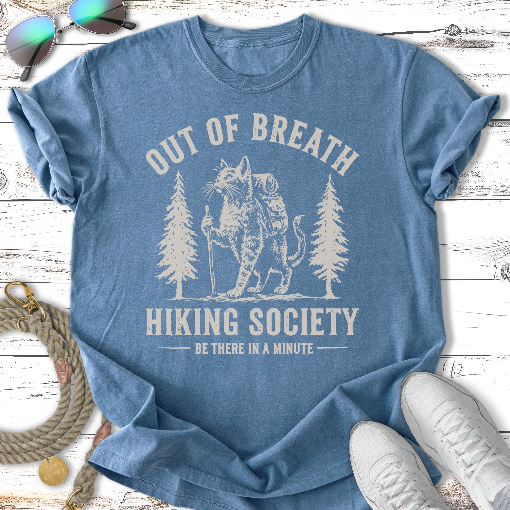 T-shirt with "Out of Breath Hiking Society" and cat graphic.