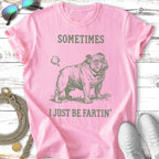 Pink t-shirt with a bulldog graphic and text "SOMETIMES I JUST BE FARTIN'".