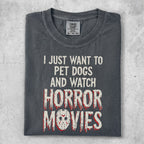 Dark t-shirt with "I JUST WANT TO PET DOGS AND WATCH HORROR MOVIES" text.