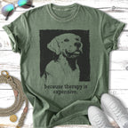 Green t-shirt with a black silhouette of a dog and the text "because therapy is expensive."