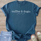 Blue t-shirt with "coffee & dogs" text and paw prints.