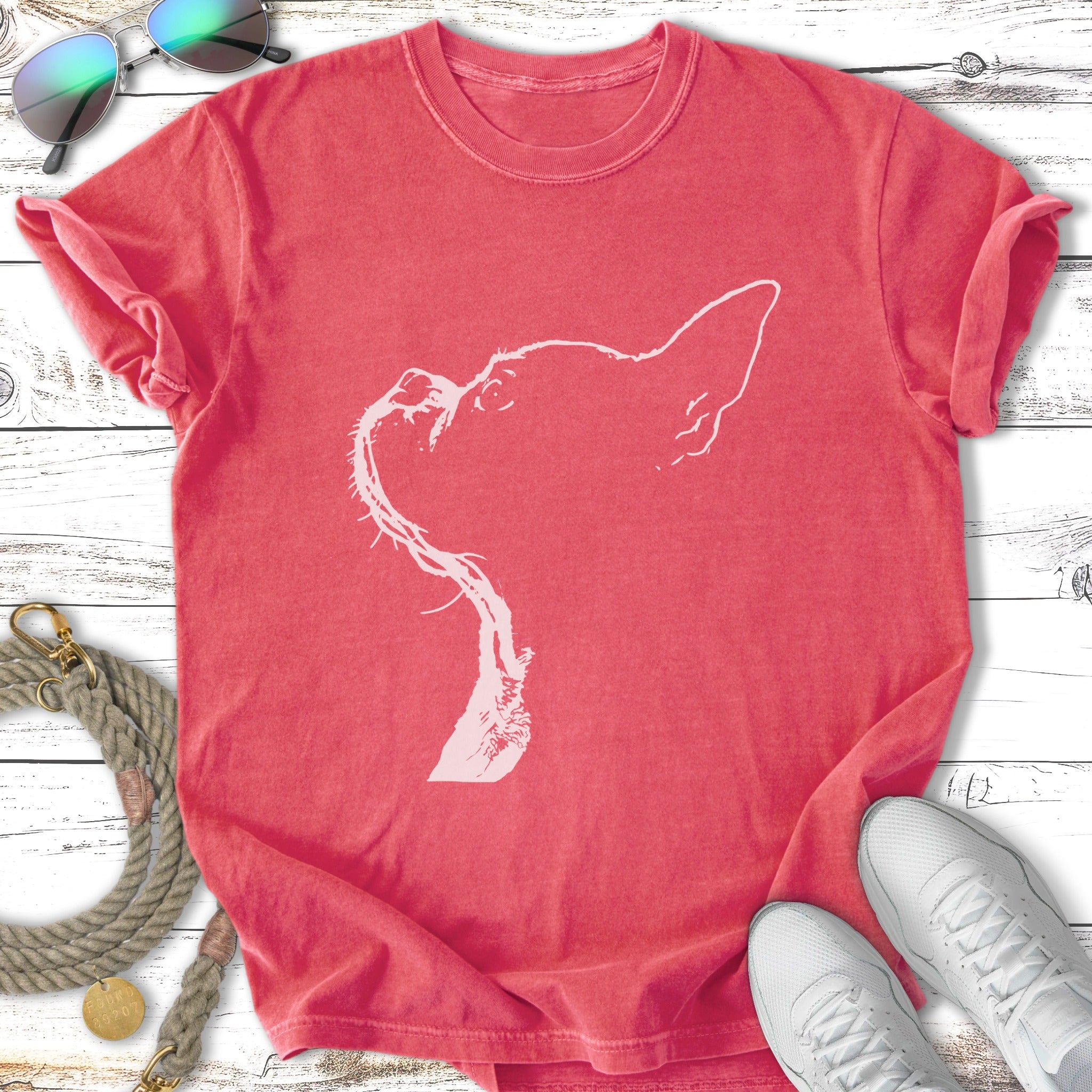 Red t-shirt with a white outline sketch of a dog's head.