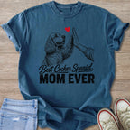 Blue t-shirt with black drawing of Cocker Spaniel giving high-five and text "Best Cocker Spaniel MOM EVER".