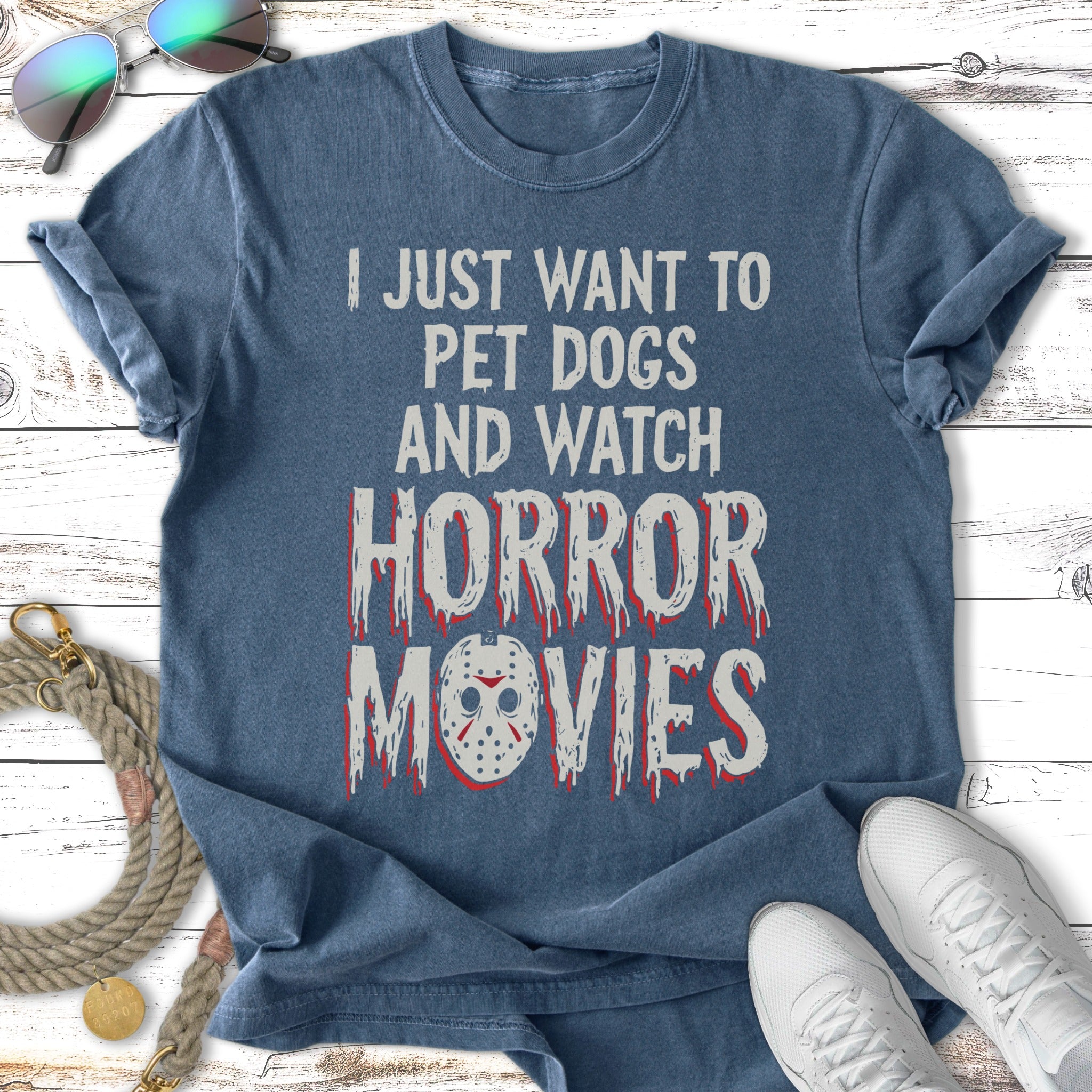 T-shirt with "I JUST WANT TO PET DOGS AND WATCH HORROR MOVIES" text and Jason mask.