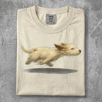 Cream t-shirt with a running golden puppy illustration.