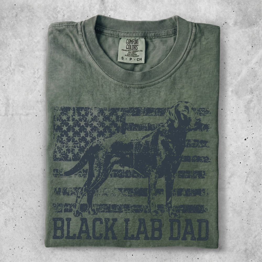 Green t-shirt with distressed American flag and black lab silhouette, text reads "BLACK LAB DAD".