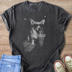 Dark t-shirt with a graphic of a corgi wearing sunglasses drinking from a cup.