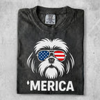 Shih Tzu wearing sunglasses with American flag design and "MERICA" text.