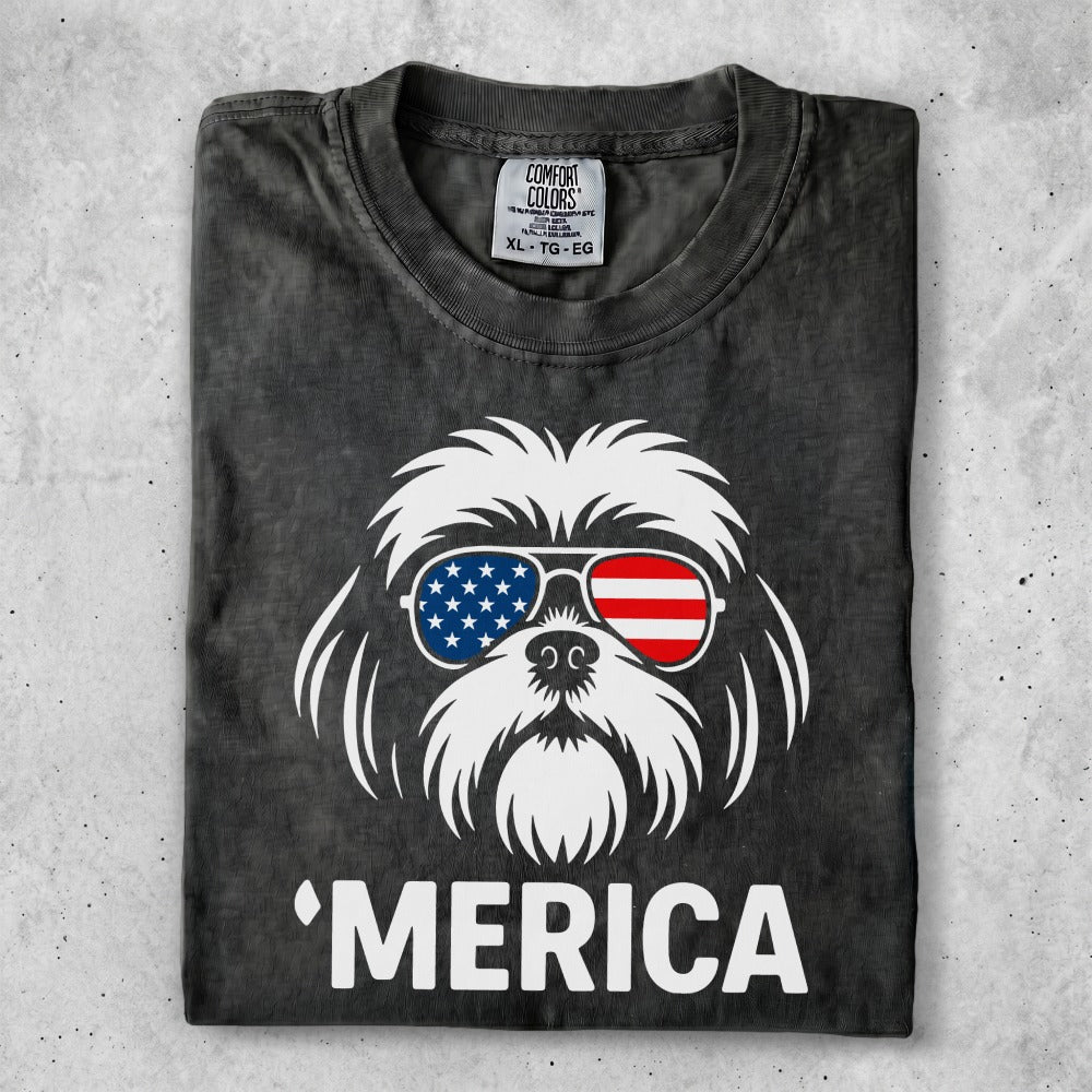 Shih Tzu wearing sunglasses with American flag design and "MERICA" text.