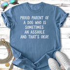 Blue t-shirt with text "Proud parent of a dog who is sometimes an asshole and that's okay."