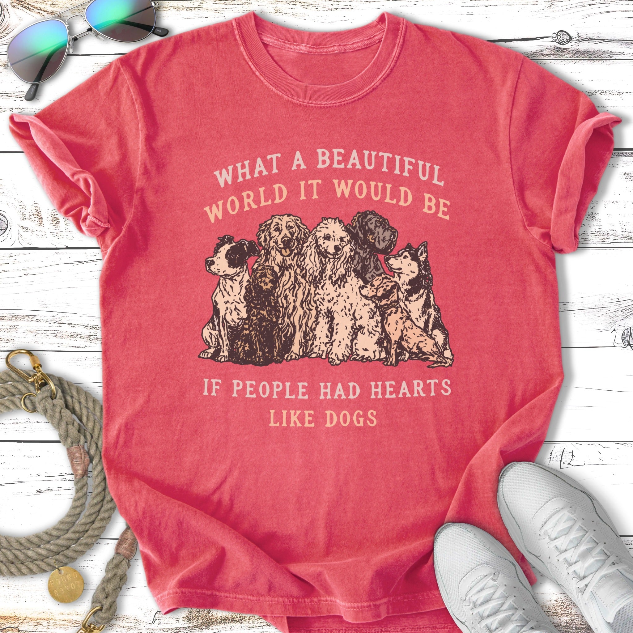Red t-shirt with dogs and text "What a beautiful world it would be if people had hearts like dogs."