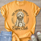 T-shirt with golden doodle in a wreath holding a coffee cup, text: The Golden Doodle Coffee Club.