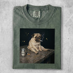 Pug smoking cigarette next to a can of beer on a stone surface.