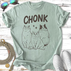 Three line art cats with "CHONK" text above them on a light green t-shirt.