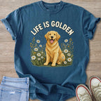 T-shirt with a golden retriever sitting in daisies and text "LIFE IS GOLDEN".