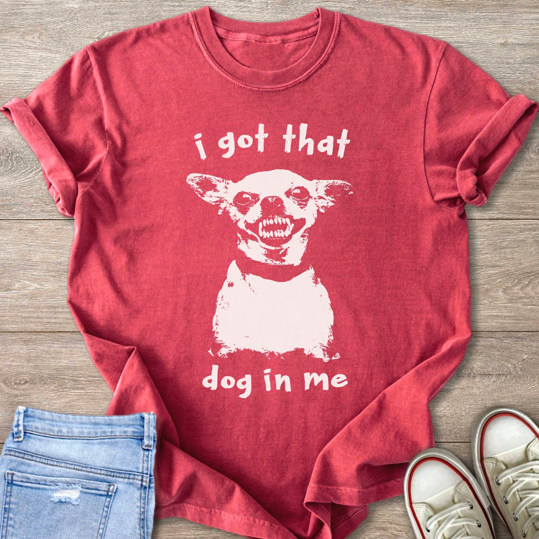 Red t-shirt with a distressed white print of a chihuahua and text "i got that dog in me".