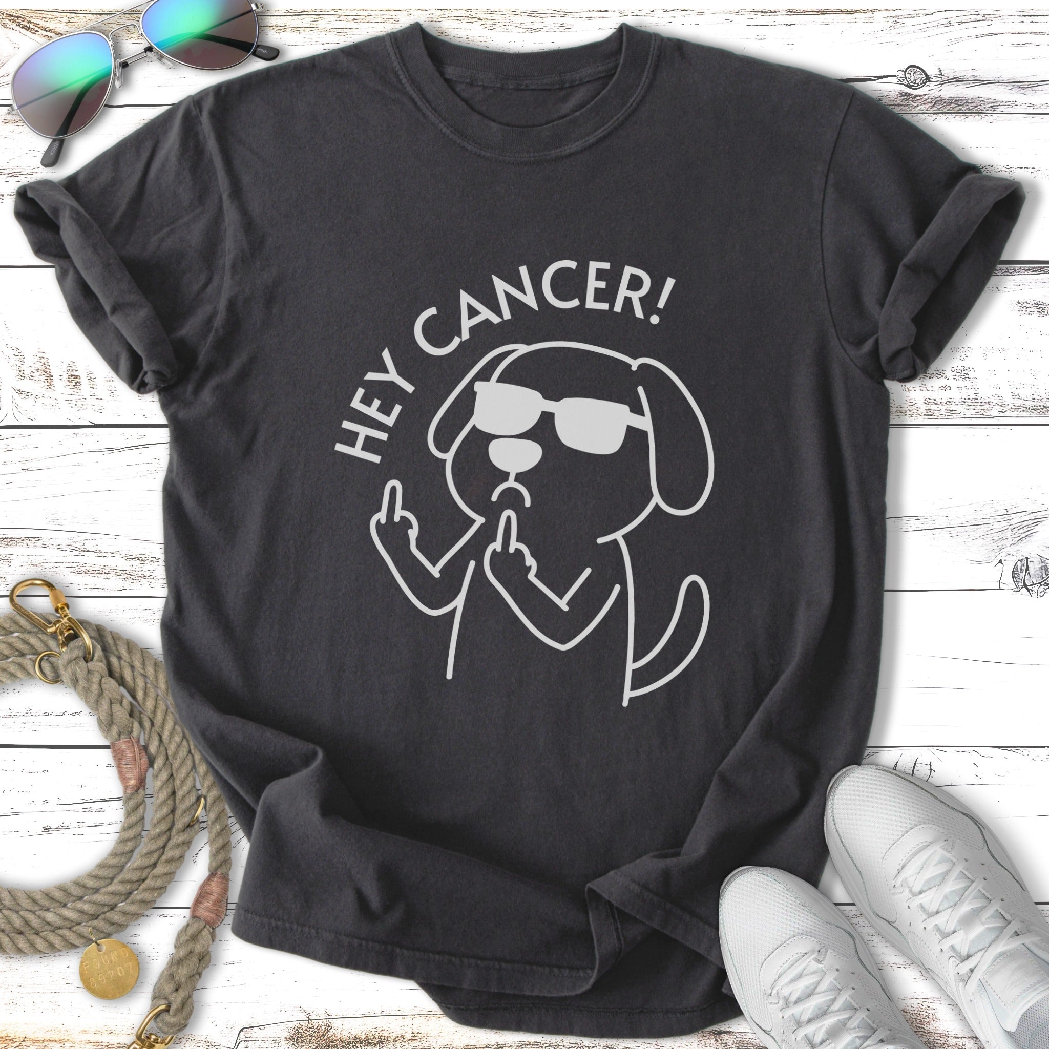 T-shirt with a cartoon dog wearing sunglasses and giving the middle finger, saying "Hey Cancer!".