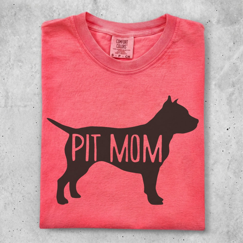 Coral t-shirt with a black pit bull silhouette and "PIT MOM" text.