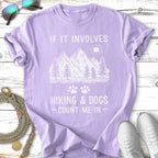 Purple t-shirt with mountains, trees, and text "If it involves hiking & dogs - count me in".