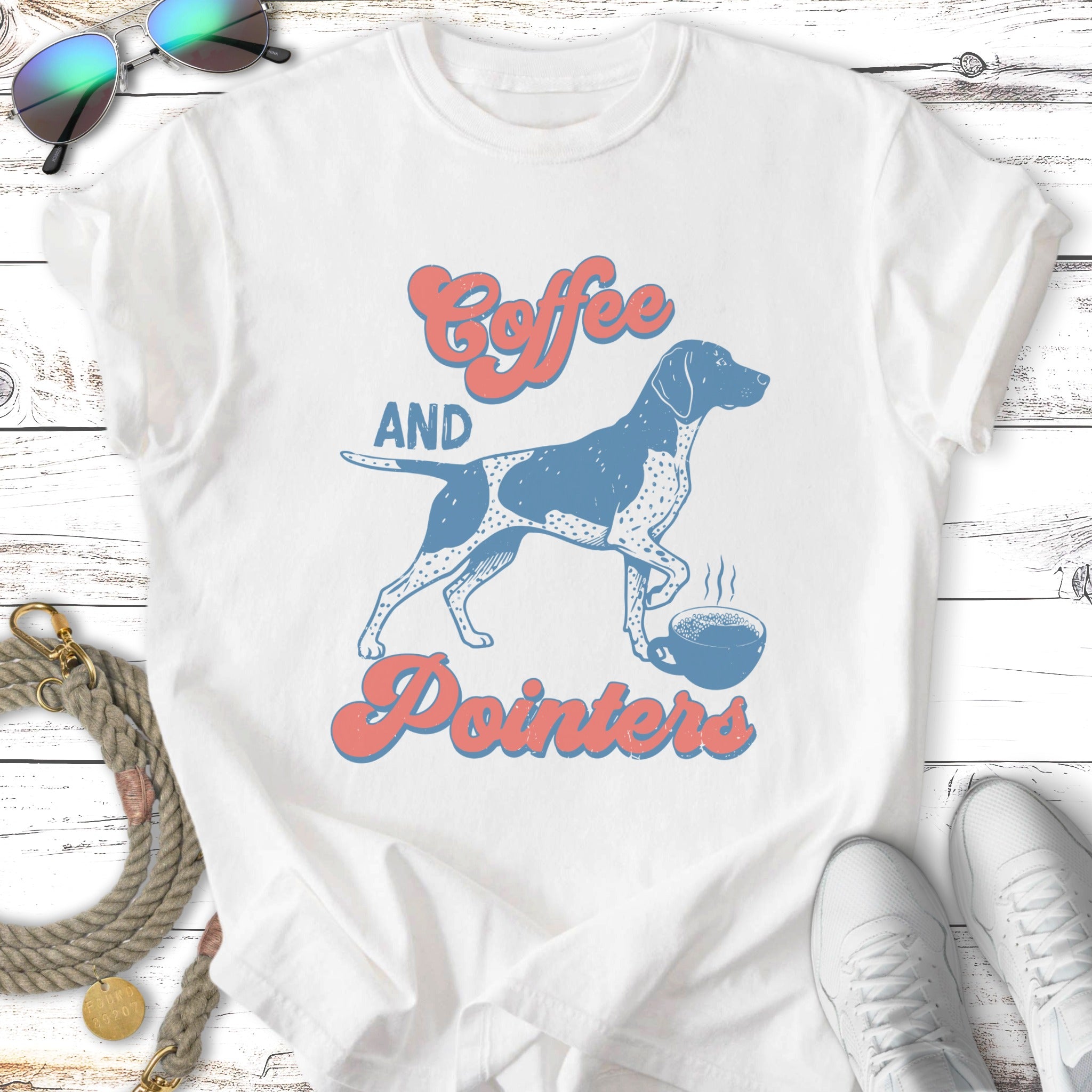 White t-shirt with blue and coral "Coffee and Pointers" graphic featuring a dog and coffee cup.